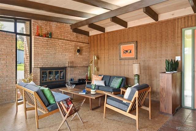 5450 Mohawk Rd, Littleton, CO 80123 - living area with beamed ceiling, a brick fireplace, brick wall, and wood walls