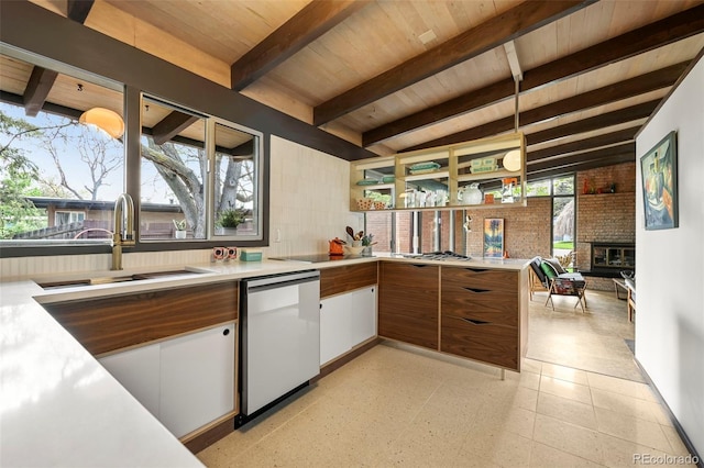 5450 Mohawk Rd, Littleton, CO 80123 - kitchen featuring a sink, dishwashing machine, light countertops, beam ceiling, and wooden ceiling
