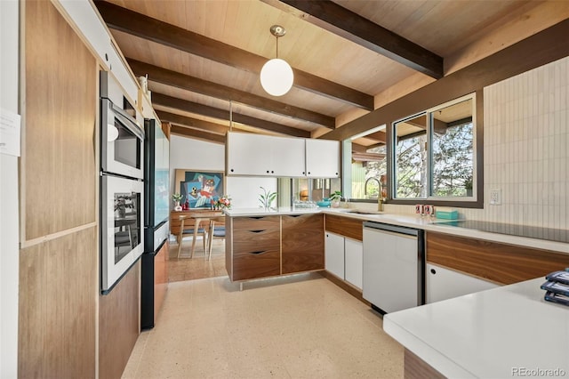 5450 Mohawk Rd, Littleton, CO 80123 - kitchen featuring dishwashing machine, a sink, wooden ceiling, beamed ceiling, and black electric stovetop