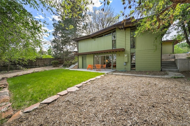 5450 Mohawk Rd, Littleton, CO 80123 - rear view of house with a patio area