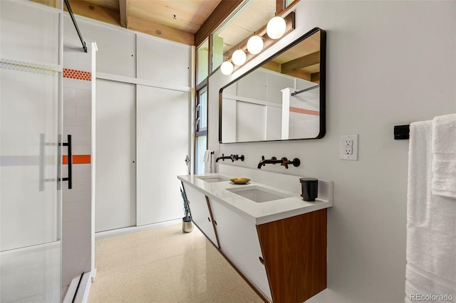 5450 Mohawk Rd, Littleton, CO 80123 - full bathroom with an enclosed shower, double vanity, and tile patterned floors