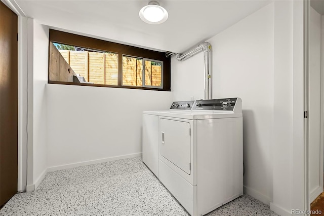 5450 Mohawk Rd, Littleton, CO 80123 - washroom with washing machine and dryer and baseboards