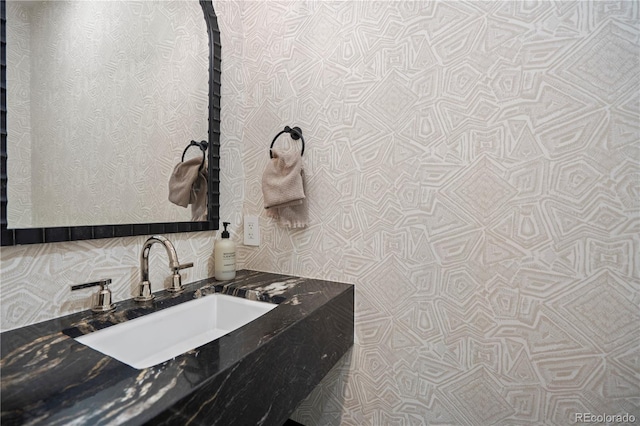 332 S Franklin St, Denver, CO 80209 - bathroom with a sink and tasteful backsplash