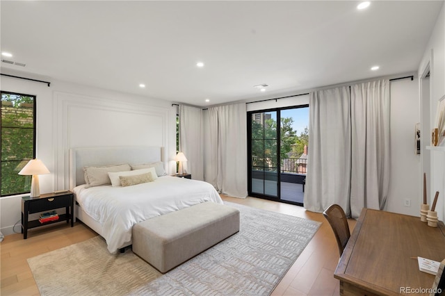 332 S Franklin St, Denver, CO 80209 - bedroom with access to exterior, light wood-type flooring, and recessed lighting
