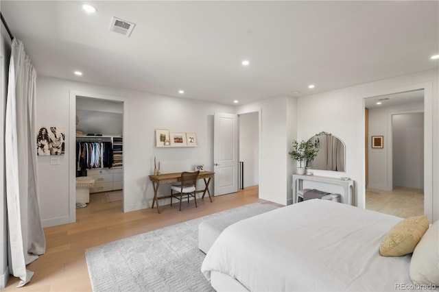 332 S Franklin St, Denver, CO 80209 - bedroom with recessed lighting, light wood-style flooring, and a walk in closet