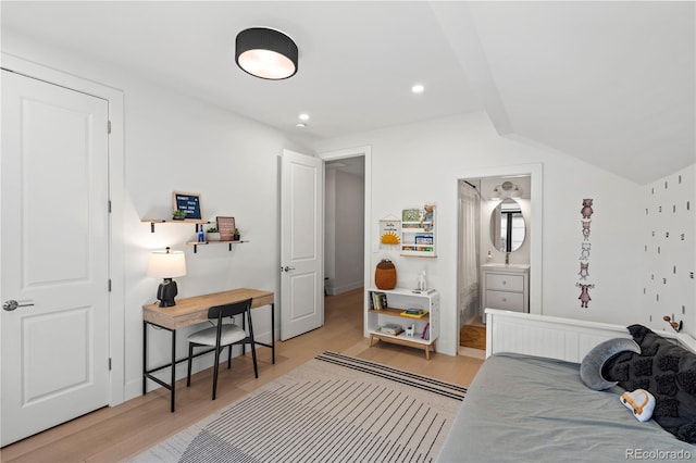 332 S Franklin St, Denver, CO 80209 - bedroom with light wood-style floors, vaulted ceiling, recessed lighting, and ensuite bath