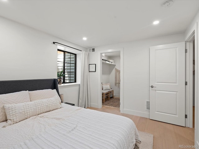 332 S Franklin St, Denver, CO 80209 - bedroom featuring light wood finished floors, recessed lighting, and a walk in closet