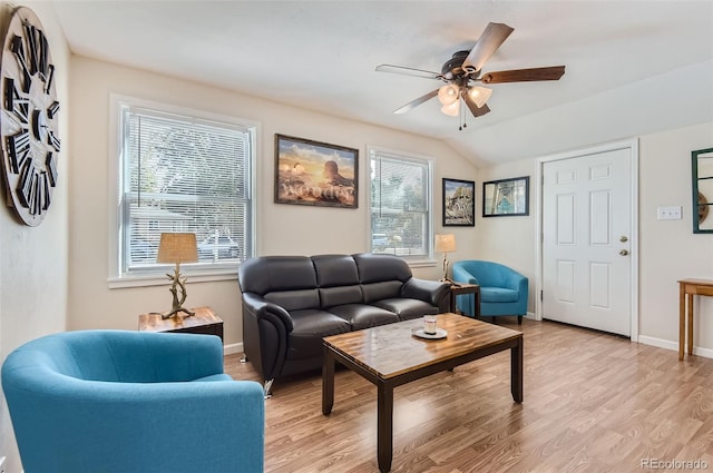 living room with light hardwood / wood-style flooring, lofted ceiling, plenty of natural light, and ceiling fan