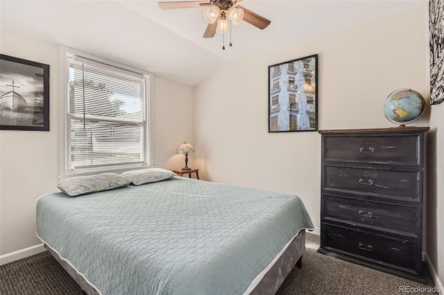 bedroom featuring carpet flooring, vaulted ceiling, and ceiling fan