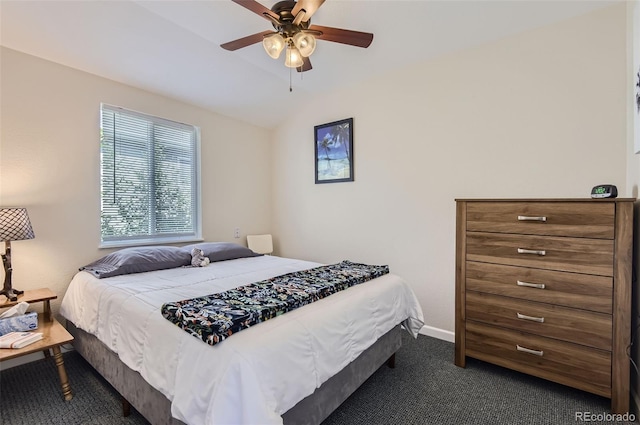 carpeted bedroom featuring lofted ceiling and ceiling fan