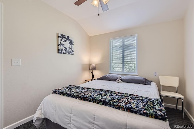 bedroom featuring ceiling fan, vaulted ceiling, and carpet floors