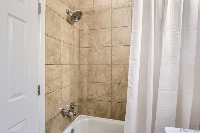 bathroom featuring shower / bath combo with shower curtain