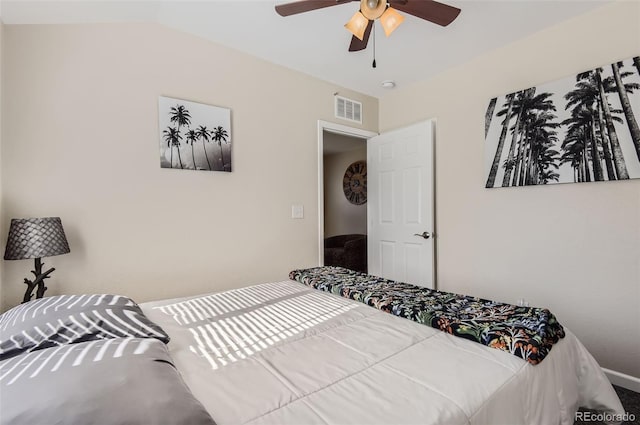 bedroom featuring vaulted ceiling and ceiling fan