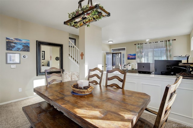 view of carpeted dining area