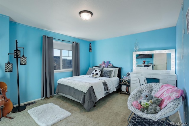 bedroom featuring light colored carpet