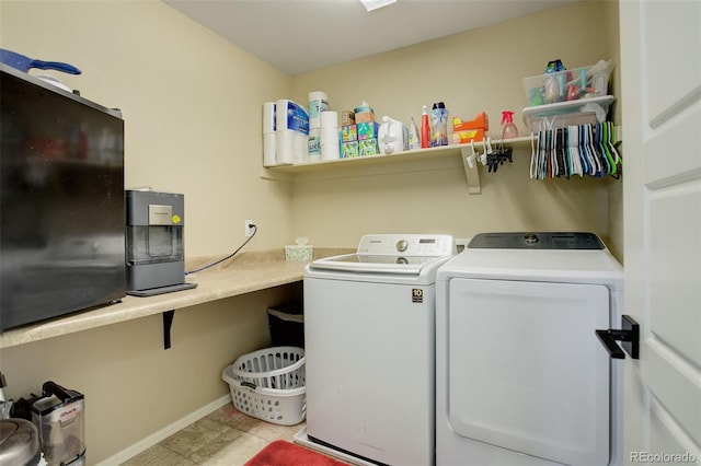 clothes washing area featuring washer and clothes dryer