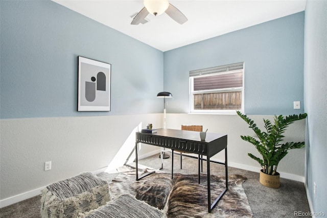 home office featuring a ceiling fan, baseboards, and carpet