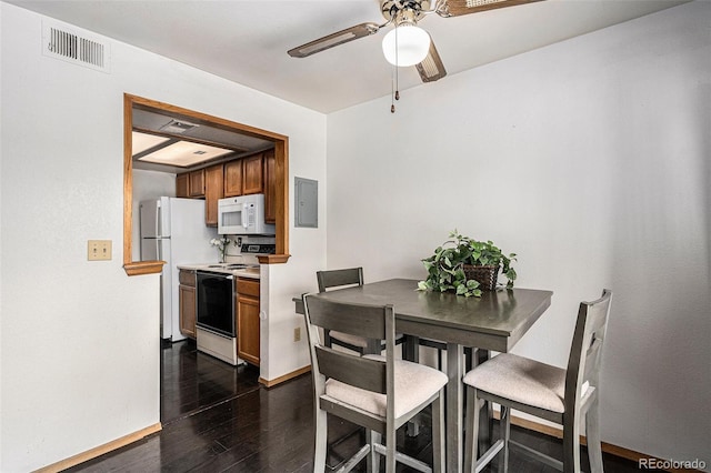 19192 E Wyoming Pl Unit 105, Aurora, CO 80017 - dining room featuring electric panel, dark wood-type flooring, and ceiling fan