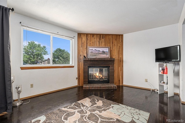 19192 E Wyoming Pl Unit 105, Aurora, CO 80017 - living area featuring hardwood / wood-style floors and a fireplace