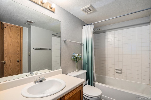 19192 E Wyoming Pl Unit 105, Aurora, CO 80017 - full bathroom featuring a textured wall, vanity, a textured ceiling, and shower / bathtub combination with curtain
