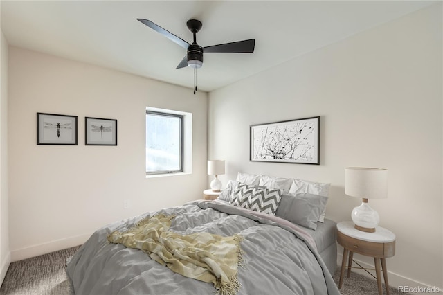 carpeted bedroom with baseboards and a ceiling fan