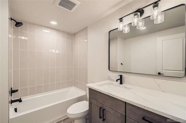 bathroom with  shower combination, visible vents, vanity, and toilet