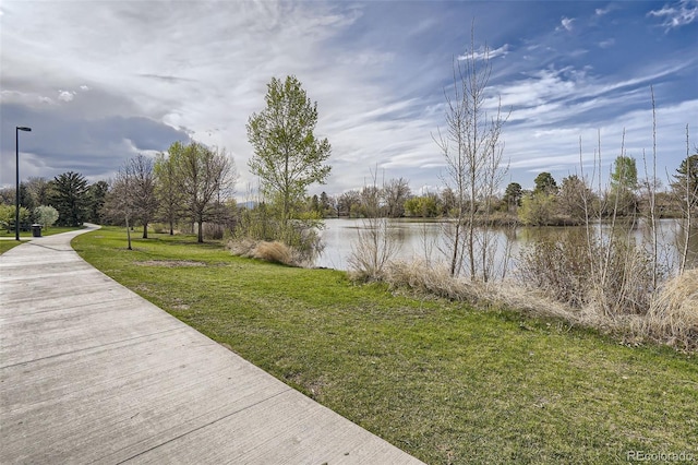exterior space featuring a water view and a yard