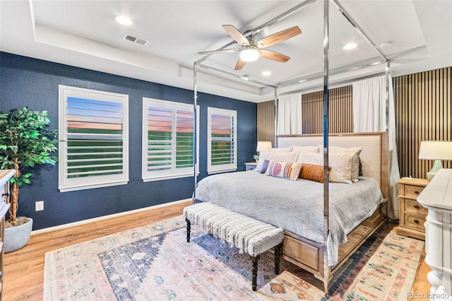 17335 W 94th Ave, Arvada, CO 80007 - bedroom featuring a raised ceiling, wood finished floors, recessed lighting, baseboards, and a ceiling fan