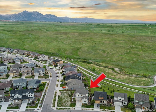17335 W 94th Ave, Arvada, CO 80007 - aerial view of property and surrounding area with a mountain backdrop, rural landscape, and nearby suburban area