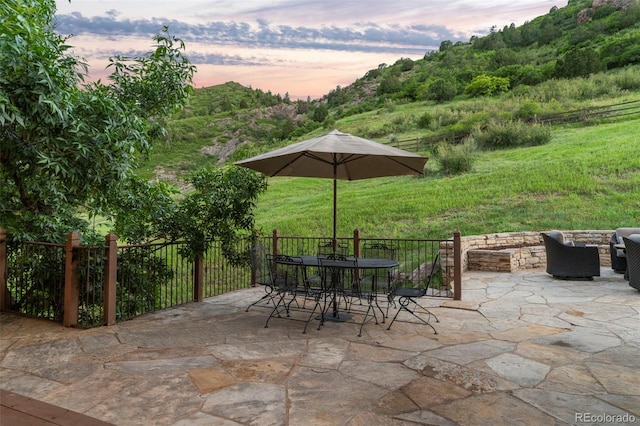 view of patio terrace at dusk