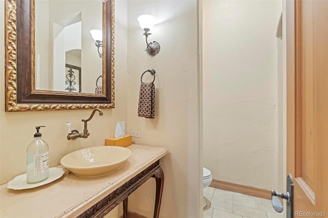 bathroom with sink and toilet