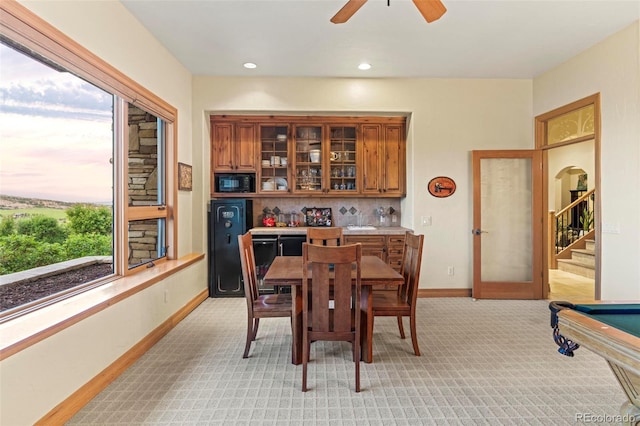 carpeted dining area with pool table, french doors, and ceiling fan