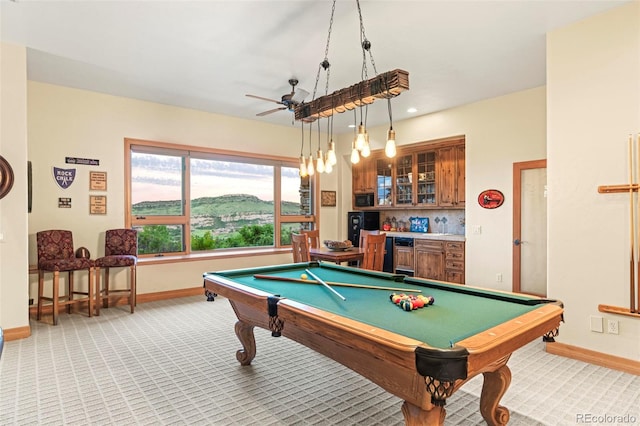 rec room featuring light carpet, billiards, ceiling fan, and bar