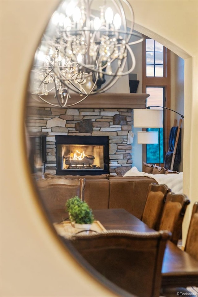 interior space with a notable chandelier and a fireplace