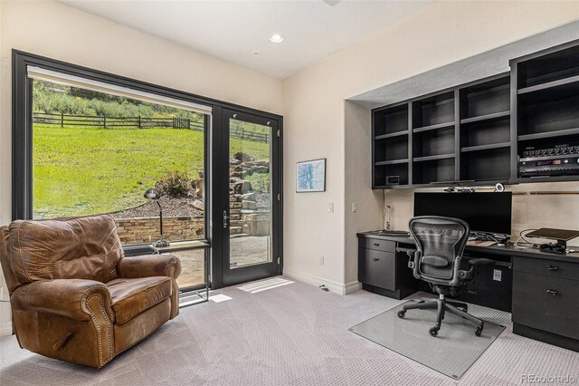 12963 Silver Elk Ln, Littleton, CO 80127 - office with light colored carpet, built in desk, and baseboards