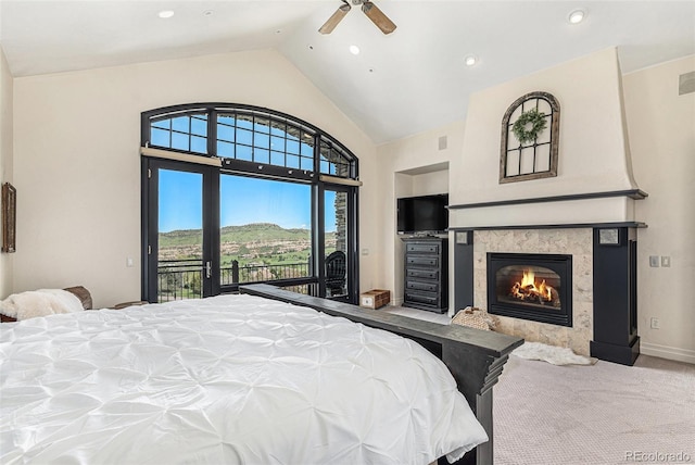 12963 Silver Elk Ln, Littleton, CO 80127 - bedroom featuring access to outside, a fireplace, high vaulted ceiling, carpet flooring, and a ceiling fan
