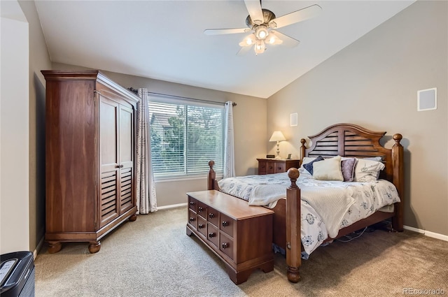 bedroom with baseboards, a ceiling fan, vaulted ceiling, and light colored carpet