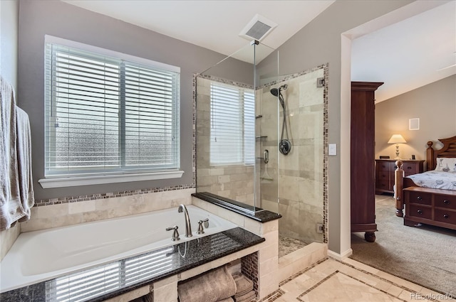 ensuite bathroom with a garden tub, visible vents, vaulted ceiling, a shower stall, and ensuite bath