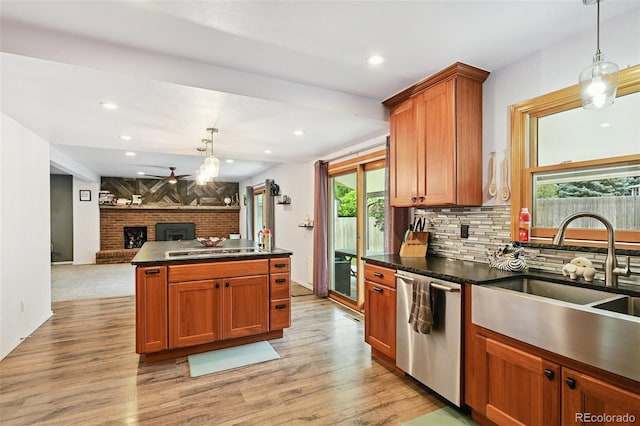 10378 W Weaver Ave, Littleton, CO 80127 - kitchen with stainless steel dishwasher, dark countertops, healthy amount of natural light, and recessed lighting
