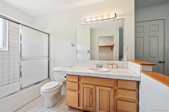10378 W Weaver Ave, Littleton, CO 80127 - bathroom featuring vanity, combined bath / shower with glass door, and tile patterned flooring