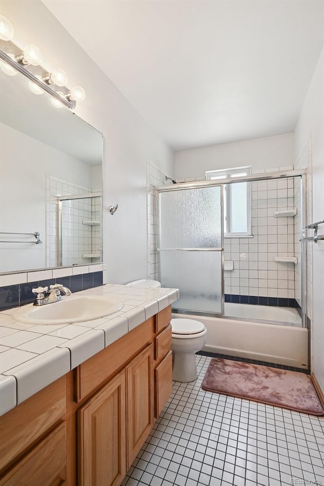 10378 W Weaver Ave, Littleton, CO 80127 - full bath with vanity, tile patterned flooring, and enclosed tub / shower combo
