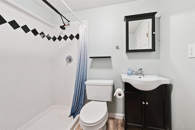 10378 W Weaver Ave, Littleton, CO 80127 - full bathroom featuring vanity, a tile shower, and wood finished floors