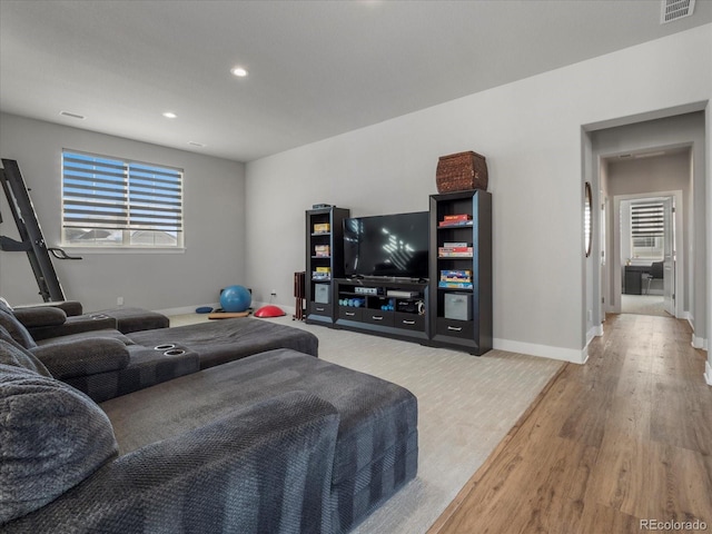 living room with light hardwood / wood-style flooring