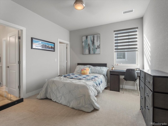 bedroom with light colored carpet