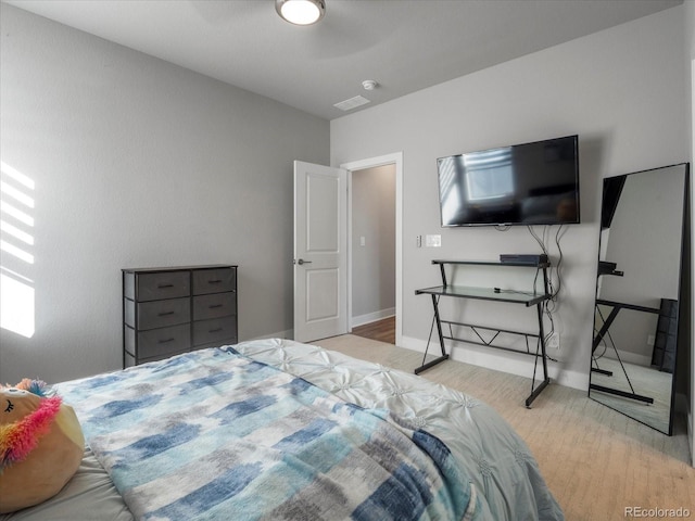 bedroom featuring light hardwood / wood-style flooring