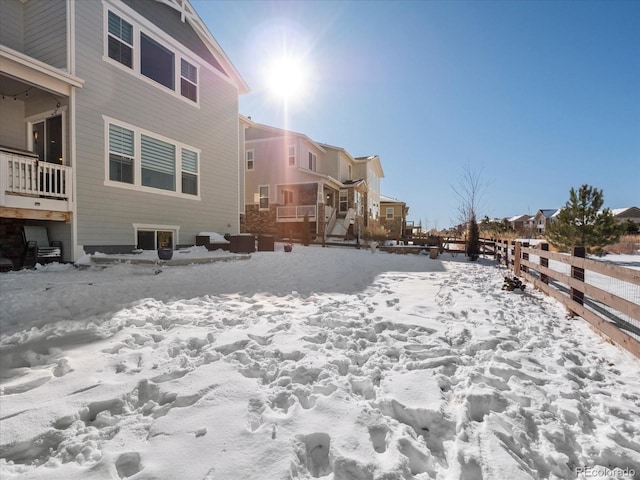 view of yard layered in snow