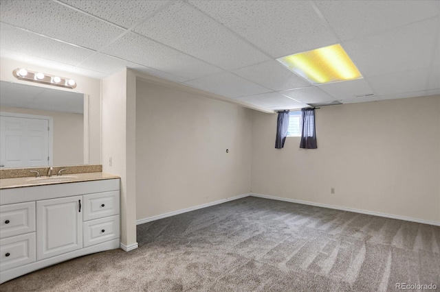 12089 W Burgundy Ave, Littleton, CO 80127 - basement with carpet flooring and a paneled ceiling
