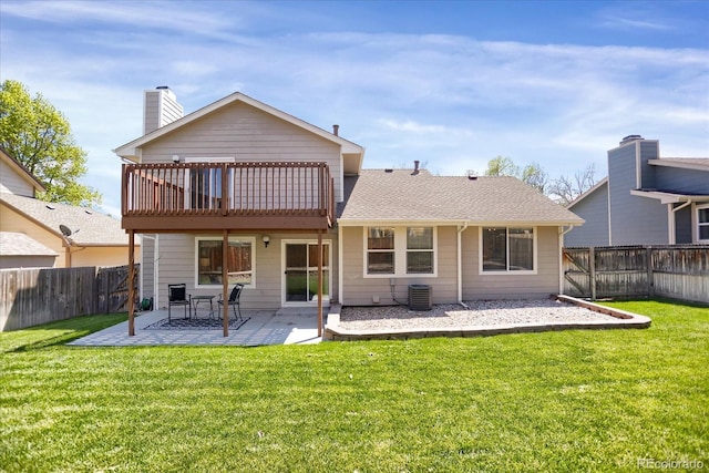12089 W Burgundy Ave, Littleton, CO 80127 - rear view of property featuring a patio area, a fenced backyard, and a chimney