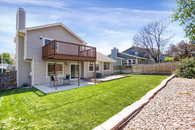 12089 W Burgundy Ave, Littleton, CO 80127 - rear view of property featuring a fenced backyard, a chimney, and a patio