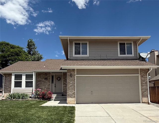 12089 W Burgundy Ave, Littleton, CO 80127 - view of front of property featuring brick siding, driveway, a front yard, a garage, and a shingled roof